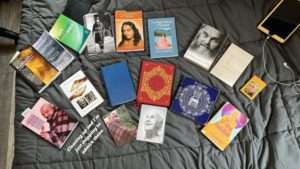 array of books that include ram dass, patanjali and the 12 step buddhist